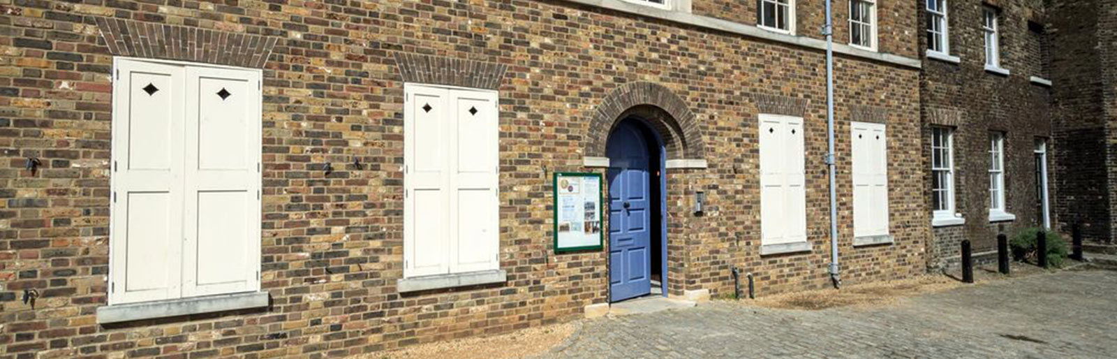 The blue front door of the Miller’s House.